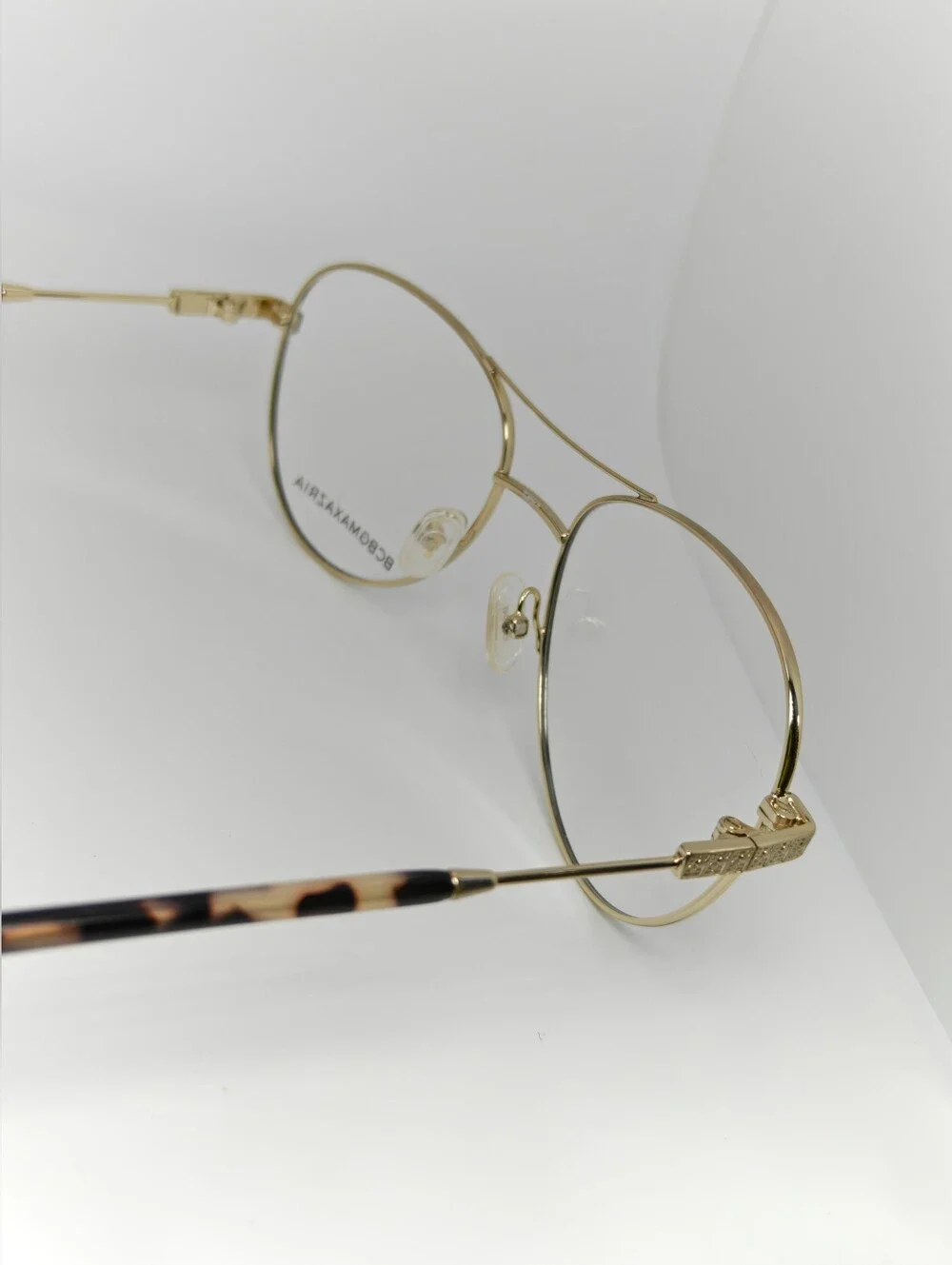 BCBGMAXAZRIA Call Aviator Eyeglass Frames in Black and Gold. Feminine.